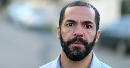 Naklejka premium Serious hispanic portrait man close-up face. 40 year old person, real people series