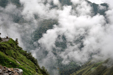 The mist covered terrain turns green during monsoon look mesmerizing at Tsomgo Lake area situated at 12,600 ft altitude under Pangolakha Wildlife Sanctuary in Sikkim...