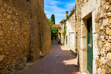 View of one of the streets of the historic center of Sant Martí d'Empúries, Costa Brava, Catalonia, Spain