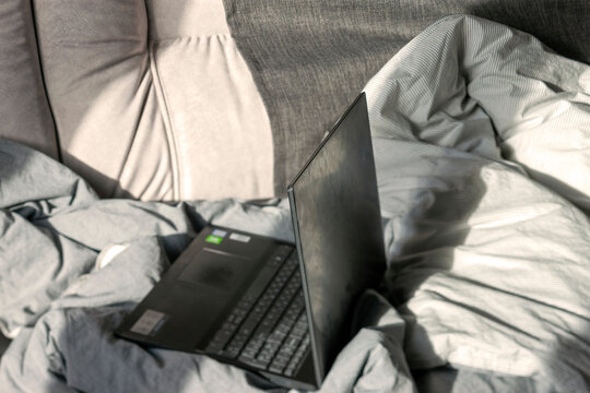 Laptop In A Messy Bed