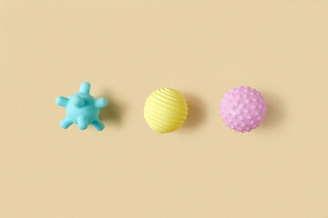 Tactile or sensory balls to enhance the cognitive processes. Top view. Flat lay. Copy Space. Textured ball set, colorful soft squeezy sensory toys to enhance physical processes