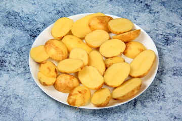 sliced new potatoes with skin on a plate