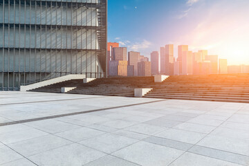 Fototapeta premium Empty square floor and city skyline with modern commercial buildings in Hangzhou at sunset, China.