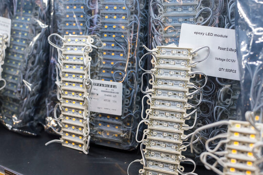 12 volt poxy LED modules lights on display at an electronics store. An array of light emitting diodes strips.