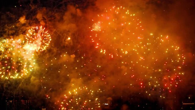 Holiday celebration, fireworks in the sky. Bright lights in honor of the event. Concept New Year and Christmas. Beautiful bright big salute