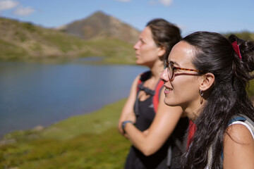 portrait of two girls looking at the pyrenees mountains. Selective focus