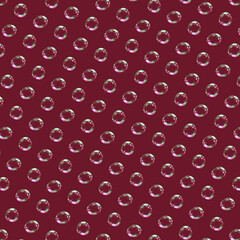 Seamless pattern of soap bubbles isolated on dark red background.