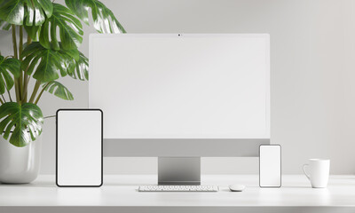 Minimal white desktop with computer, tablet and mobile