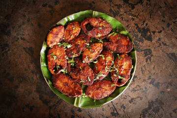 Kerala Style Fish Fry seafood seer fish fried on banana leafe