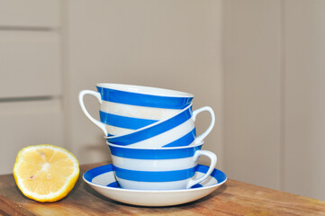 close up of cup of tea with blue stripes at home ,teatime and relax
