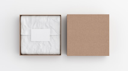 Square gift box mock up. Cardboard gift box with blank label or business card on wrapping paper. White background. View directly above.