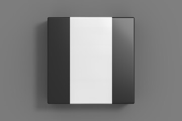 Square box mock up with blank paper cover label: Black gift box on gray background. View directly above.