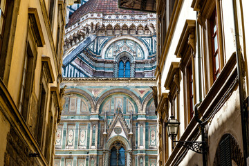 Exterior of the Cathedral of Santa Maria del Fiore duomo in Florence seen through a narrow street, Tuscany, Italy, Europe