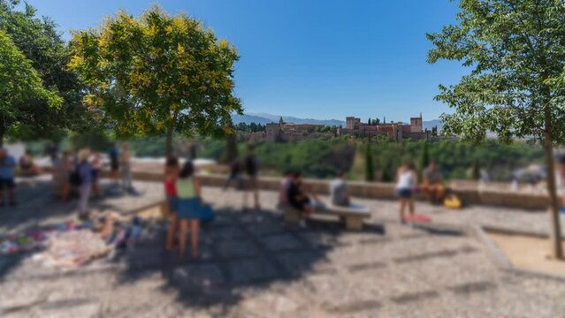 Saint Nicholas viewpoint to Alhambra with blurred tourists