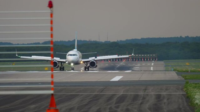 Jet airplane braking after landing at Germany Dusseldorf International Airport. Tourism and aviation concept
