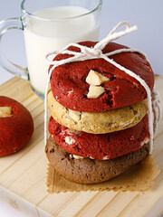 Chocolate cookies red velvet assorted flavors with cup of milk