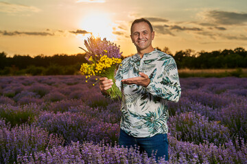 Happy farmer in his lavender field