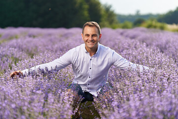 Happy farmer in his lavender field