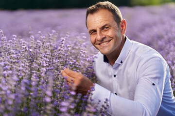 Happy farmer in his lavender field
