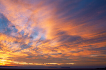 Fototapeta premium beautiful landscape on sea with sunset, dramatic clouds with red fire