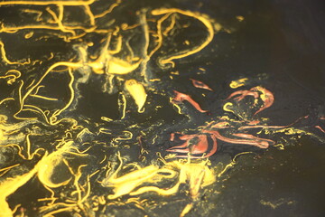 Black and yellow pigments difusion into each other Abstract colorful vivid background
