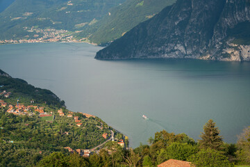 Fototapeta premium Panorama at Lake Iseo and mountains around at sunny day with clouds. Bergamo, Lombardy, Italy.