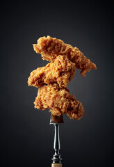 Fried chicken on a fork.