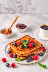 French toast with blueberries, raspberries, maple syrup