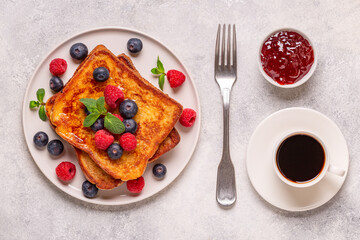 French toast with blueberries, raspberries, maple syrup