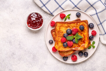 French toast with blueberries, raspberries, maple syrup