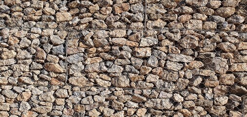 Stone wall background. The texture of the stone wall. Wall of large stones.