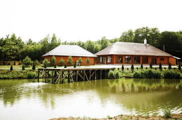 Country complex for recreation. Wooden houses near the lake