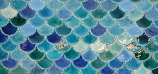Beautiful mosaic tiles in a marine style. Tile with a sea pattern. Blue tiles with a geometric pattern of scales.  © Nataly G