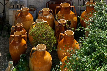 Olive oil jugs and vases in a Mediterranean garden
