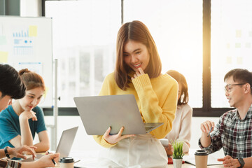 Team of Asian Start up business people working together with friends with happy action and celebrate in the modern office.