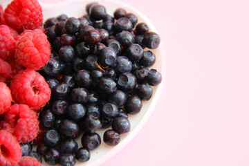 blueberries on a pink background