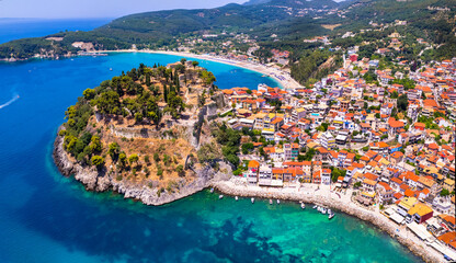 Aerial drone view of Parga colorful town and popular tourist resort in Epirus, Greece - obrazy, fototapety, plakaty