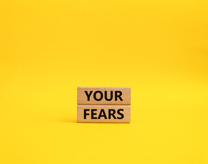 Your fears symbol. Wooden blocks with words Your fears. Beautiful yellow background. Business and Your fears concept. Copy space.