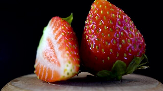 Close-up. Red strawberry. Longitudinal section of a ripe strawberry