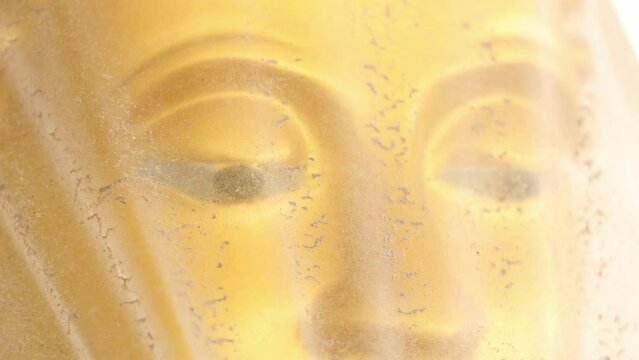 The Golden Buddha Statue Wrapped in Cellophane shows the gesture of vitarka mudra