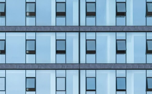 Office windows facede. Blue glass and steel frame,background texture. front view