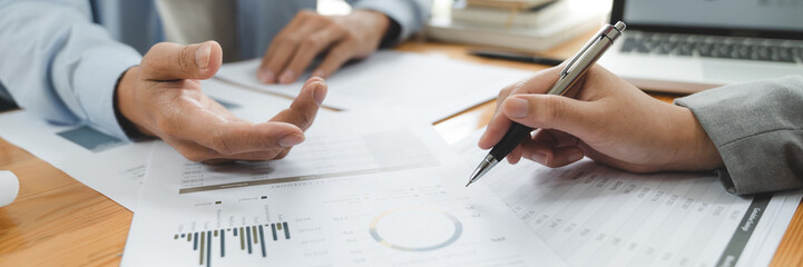 Startup business people teamwork calculating a valuation in workplace.
