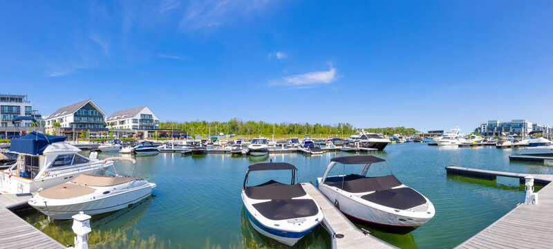 Scenic Innisfil marina and yacht club on Ontario Lake Simcoe with hotels and boat rentals.