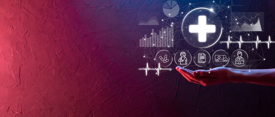 Obraz premium Businessman hold virtual plus medical network connection icons. Covid-19 pandemic develop people awareness and spread attention on their healthcare.Doctor,document,medicine,ambulance,patient icon.