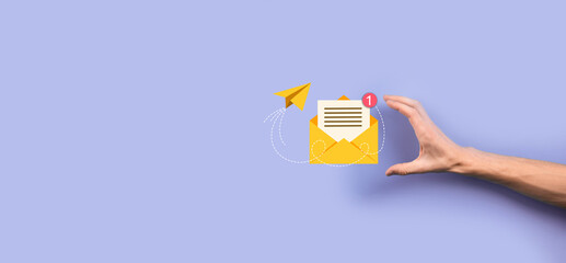 Businessman hand holding letter icon,email icons.Contact us by newsletter email and protect your personal information from spam mail.Customer service call center contact us.Email marketing newsletter.