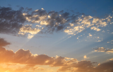 Naklejka na ściany i meble Beautiful bright sunset sky with clouds. Sky background.