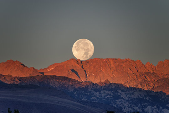 Full Moon Setting Over Sierra Mountains