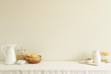 Breakfast, natural lifestyle concept, white interior composition with kitchen utensils and food on table with white tablecloth, space on wall for text, design or wall art presentation.