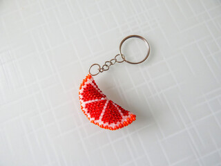 Orange key chain on a white