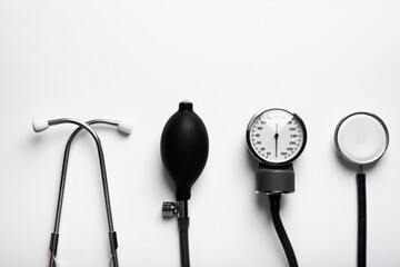 Black sphygmomanometer and medical equipment blood pressure monitor isolated on white background. Healthcare. Place for text. Medicine concept. The concept of cardiology.